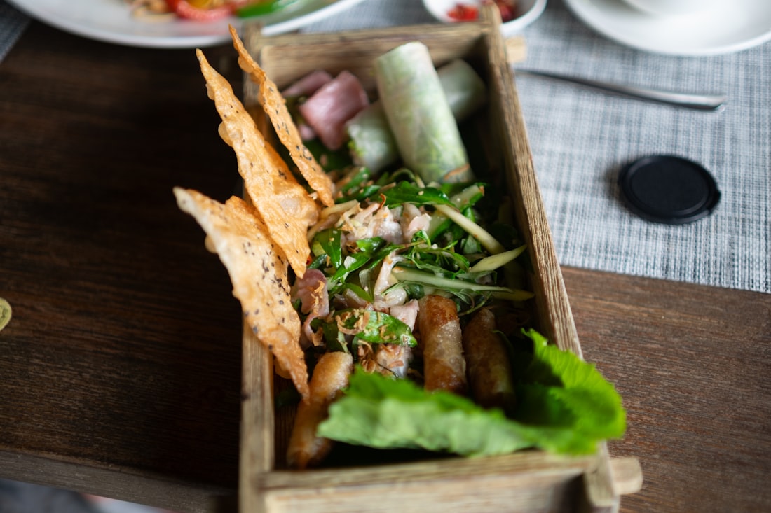 Fresh Vietnamese herbs, lime wedges, and bean sprouts — the essential side plate